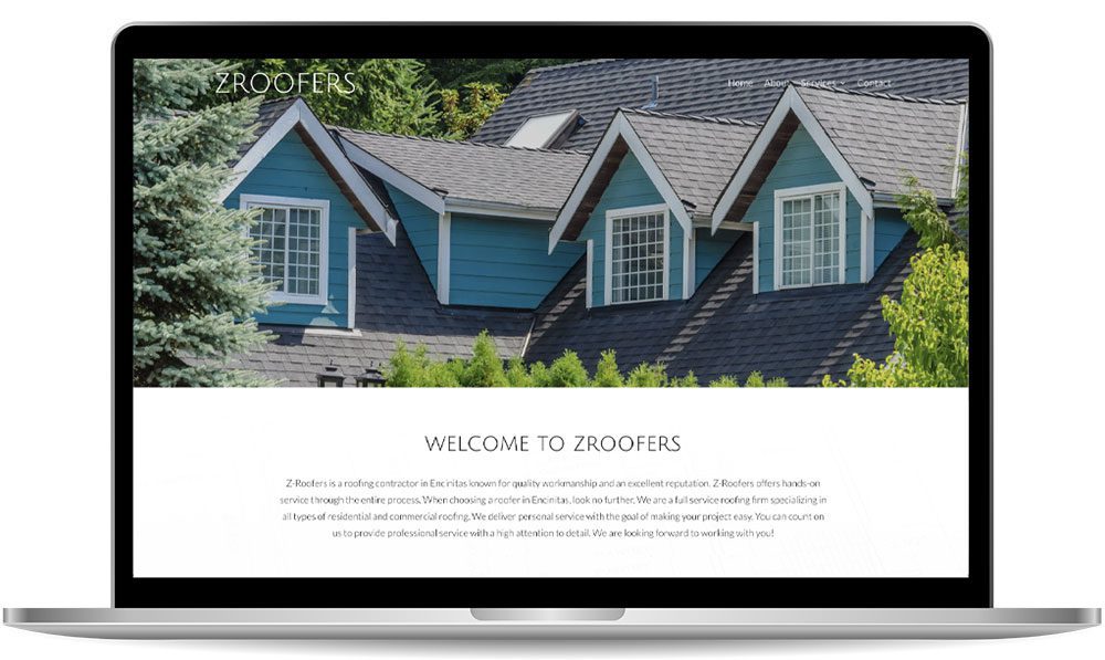 zroofers A laptop screen displaying the Z Roofers website, featuring an image of a house with blue siding and multiple gabled roofs. The site includes a welcome message from the company.