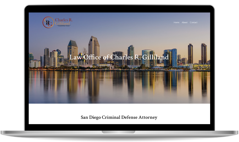 law-office Laptop screen displaying the website of the Law Office of Charles R. Gilliland, featuring the San Diego skyline and text about a criminal defense attorney.